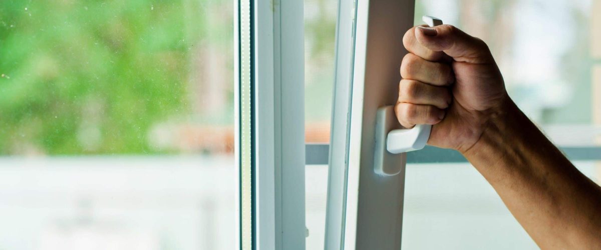 What Does Indoor Air Quality Have to Do With Allergies? Picture shows someone opening window.