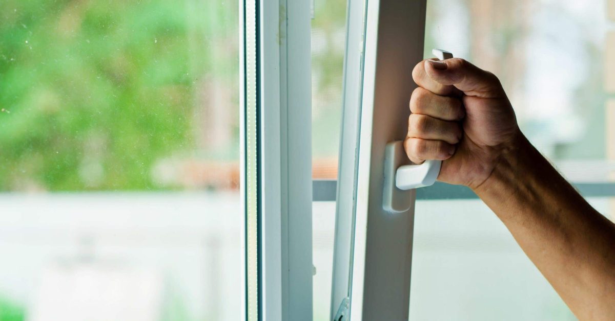 What Does Indoor Air Quality Have to Do With Allergies? Picture shows someone opening window.